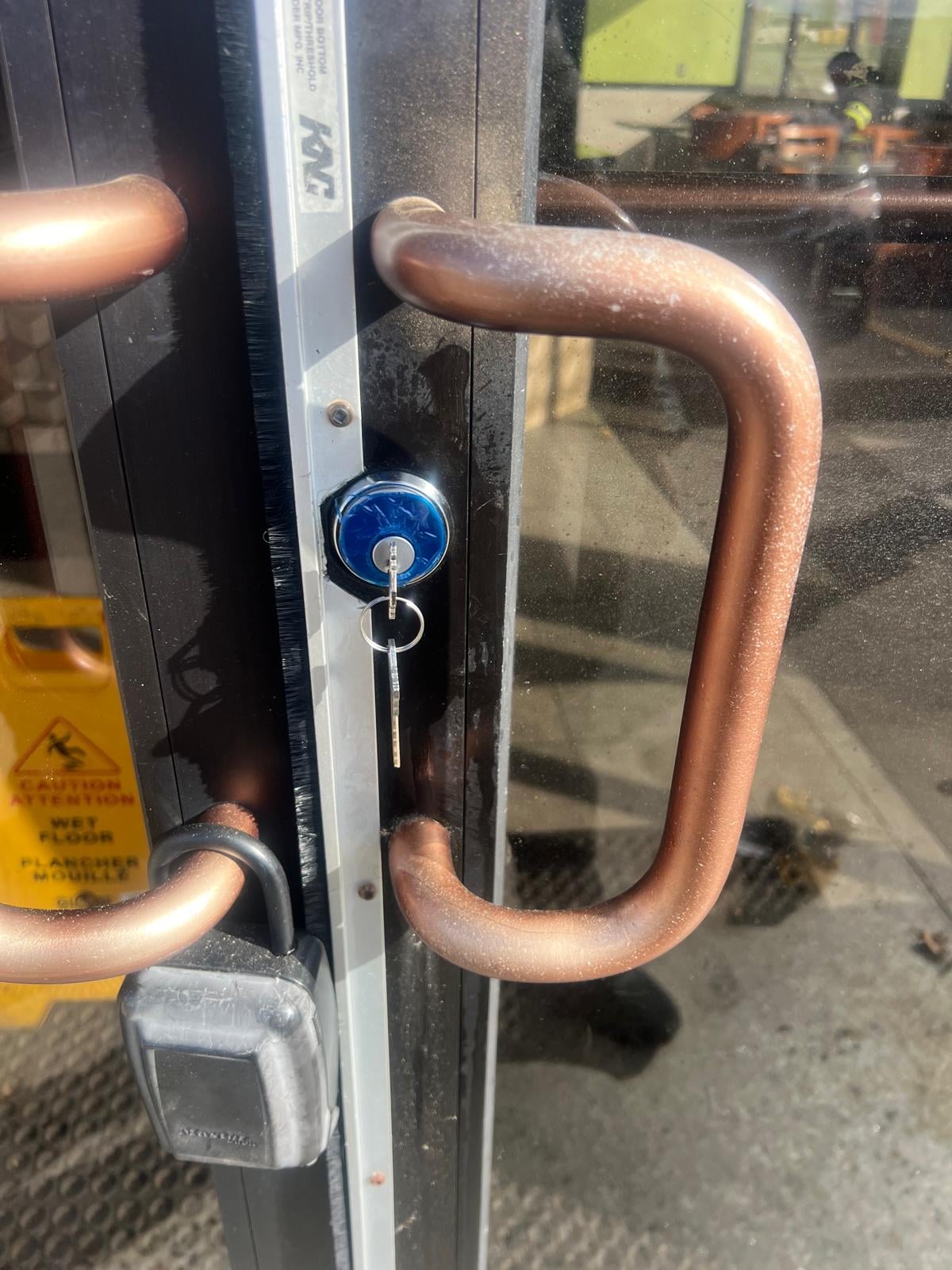 Worn residential door before replacement
