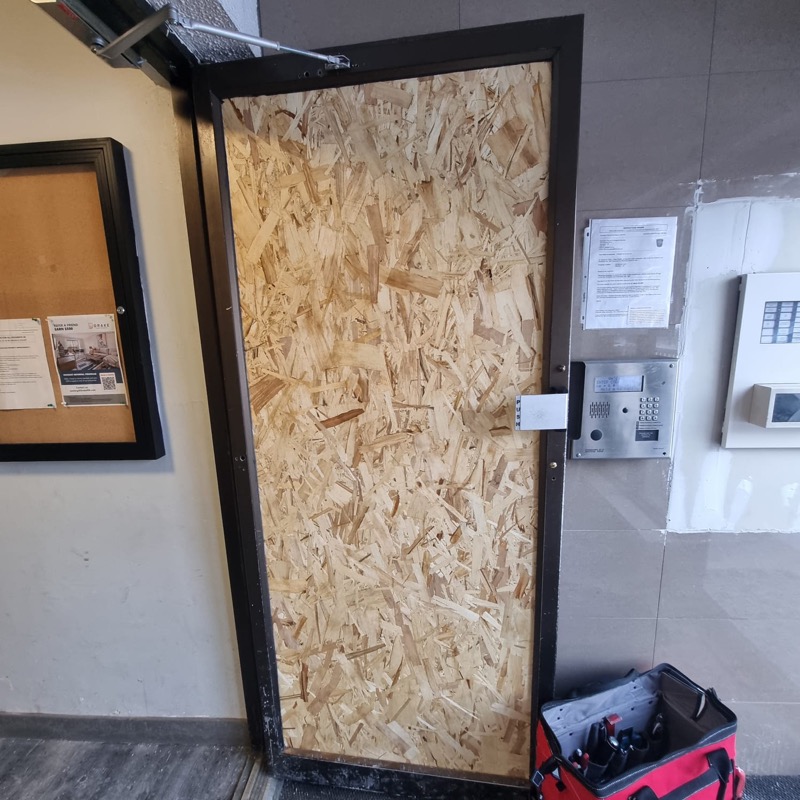 Emergency board-up on a Toronto storefront before glass replacement